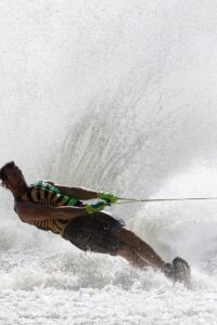 man struggling boat water skiing