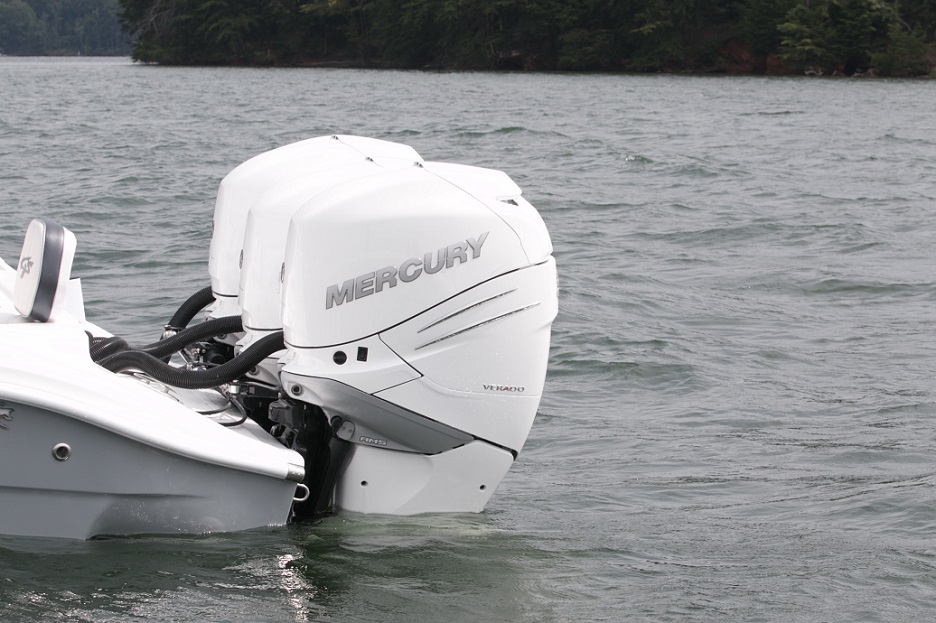 white mercury motor boat