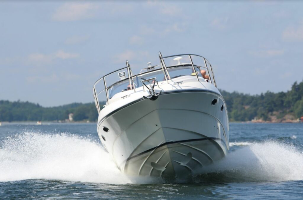 white boat with waves