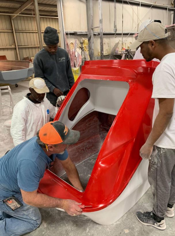 four professional fiberglass repairing the boat