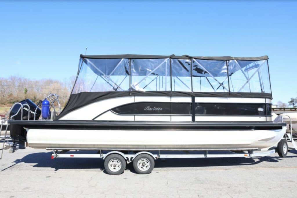 white and black barletta tritoon close boat